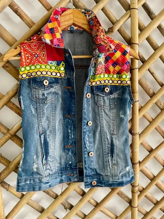 Sleeveless distressed pom pom jacket